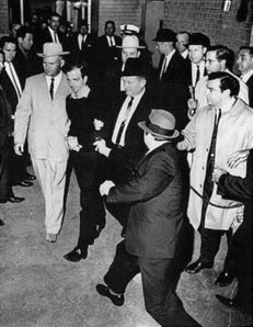 Lee_Harvey_Oswald_being_shot_by_Jack_Ruby_as_Oswald_is_being_moved_by_police,_1963